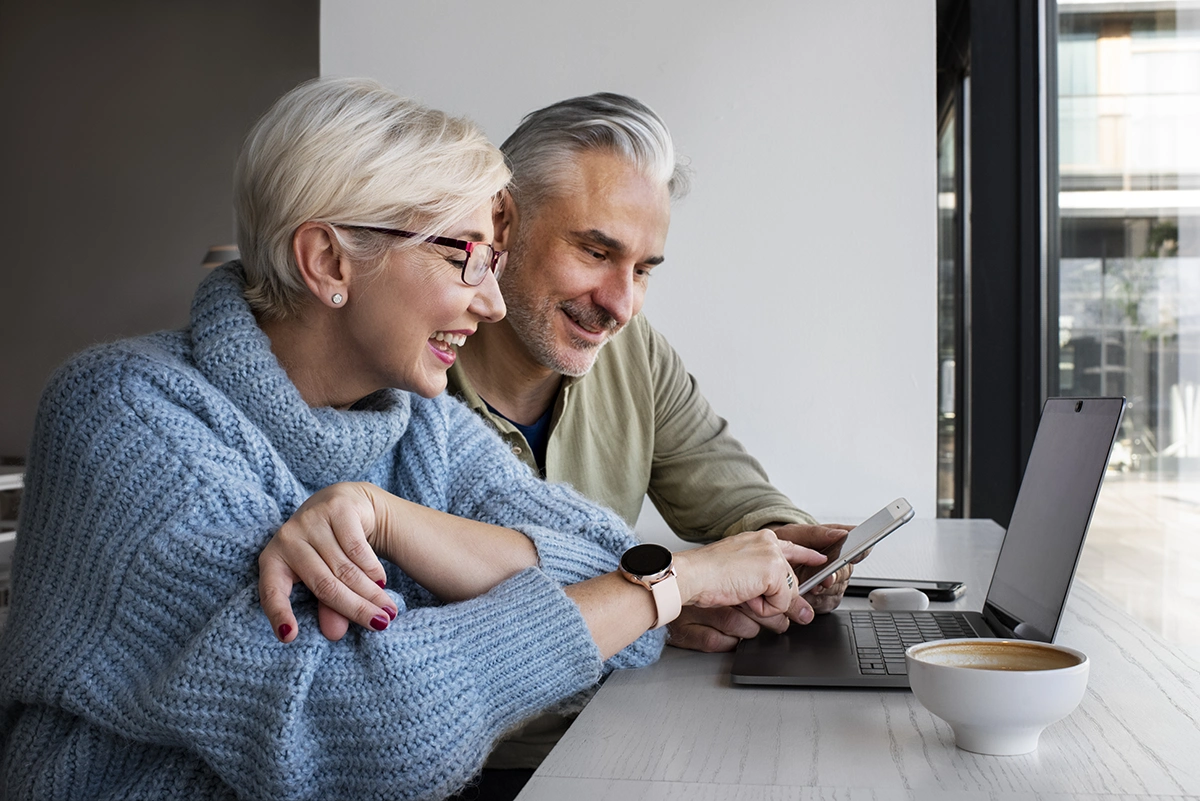 mature couple at laptop